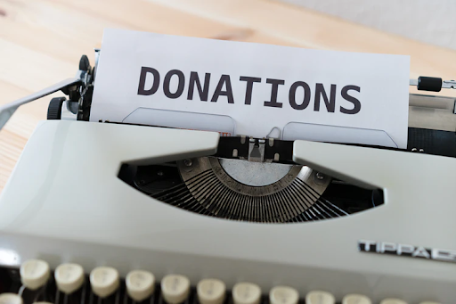 donations typed out on a typewriter